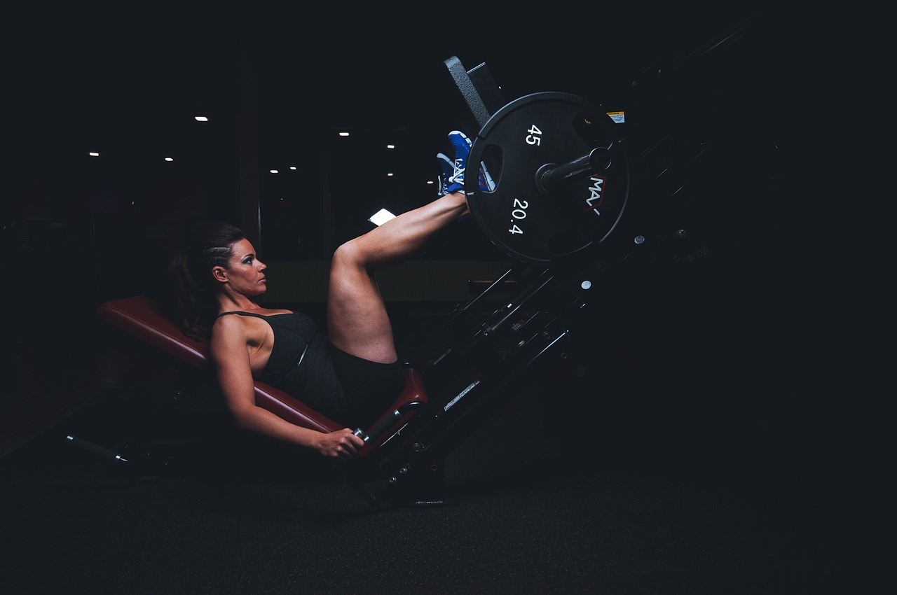 Woman performing leg press exercise A woman performing the leg press exercise